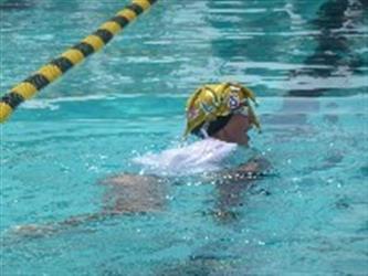 Swimmer in the water wearing a RLHS hat